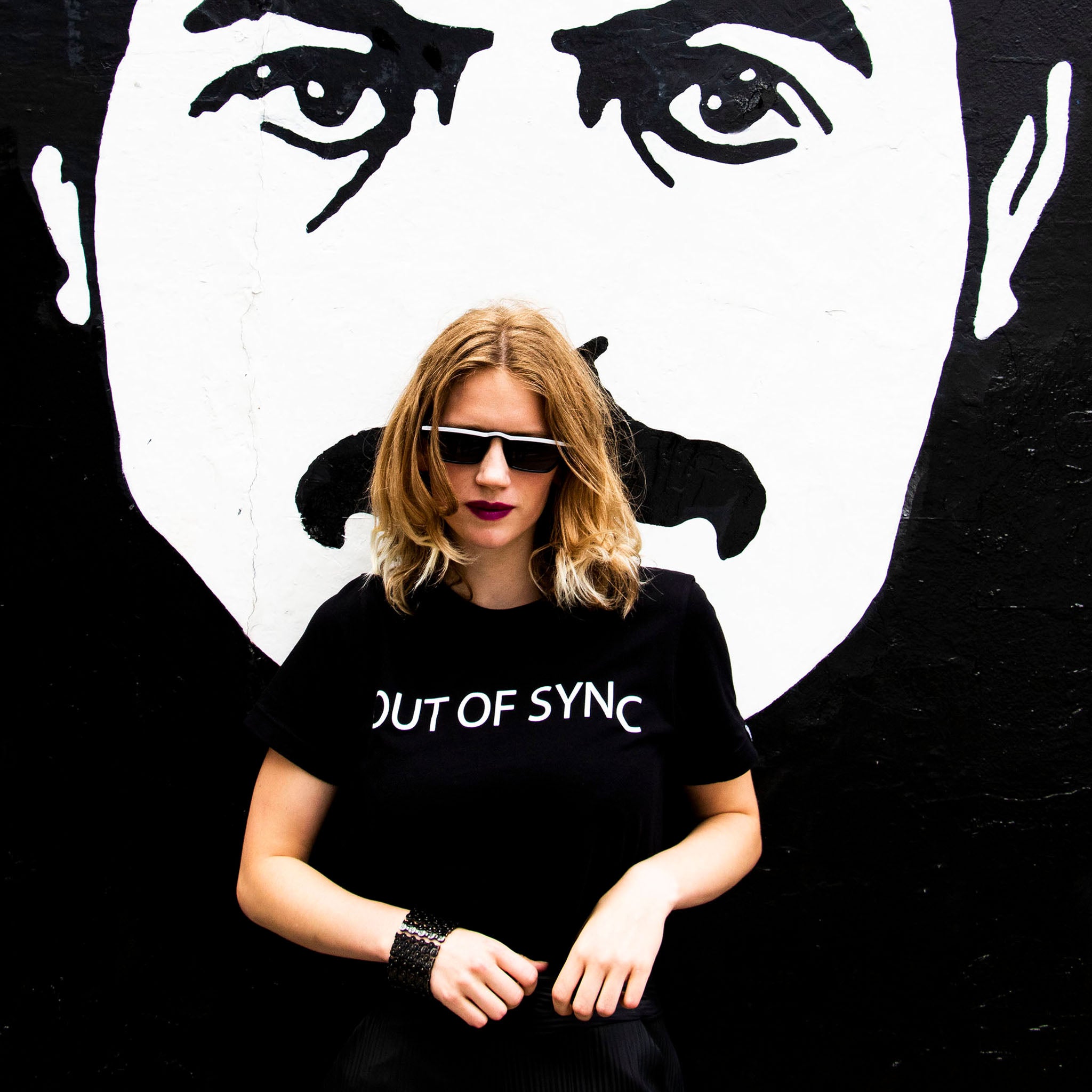 Out of Sync designer logo tee screen printed